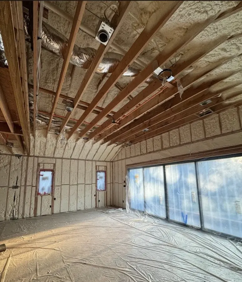 Interior walls and ceiling insulated with spray foam during new construction in Portsmouth